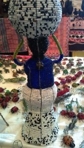 The Kotwa artists can make anything using the wire and beads. among the animals, we have seen cars and people figurines. Here you can see a figure of a lady carring traditional backet on her head